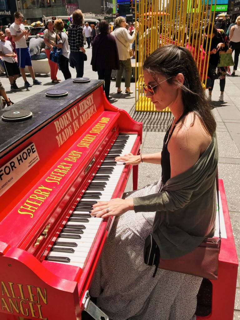 jess pendergrass playing piano in times square